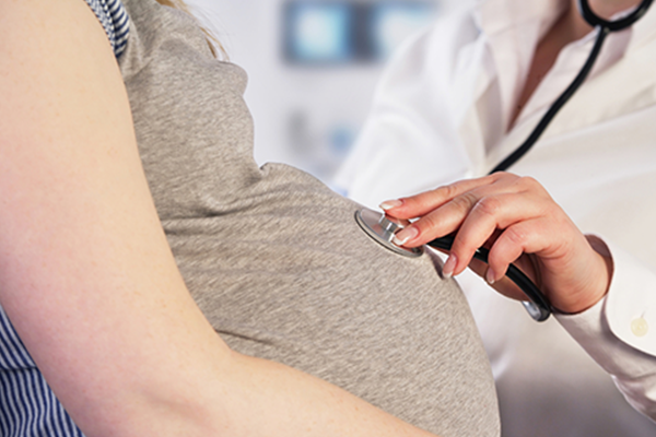 a doctor checking pregnant woman